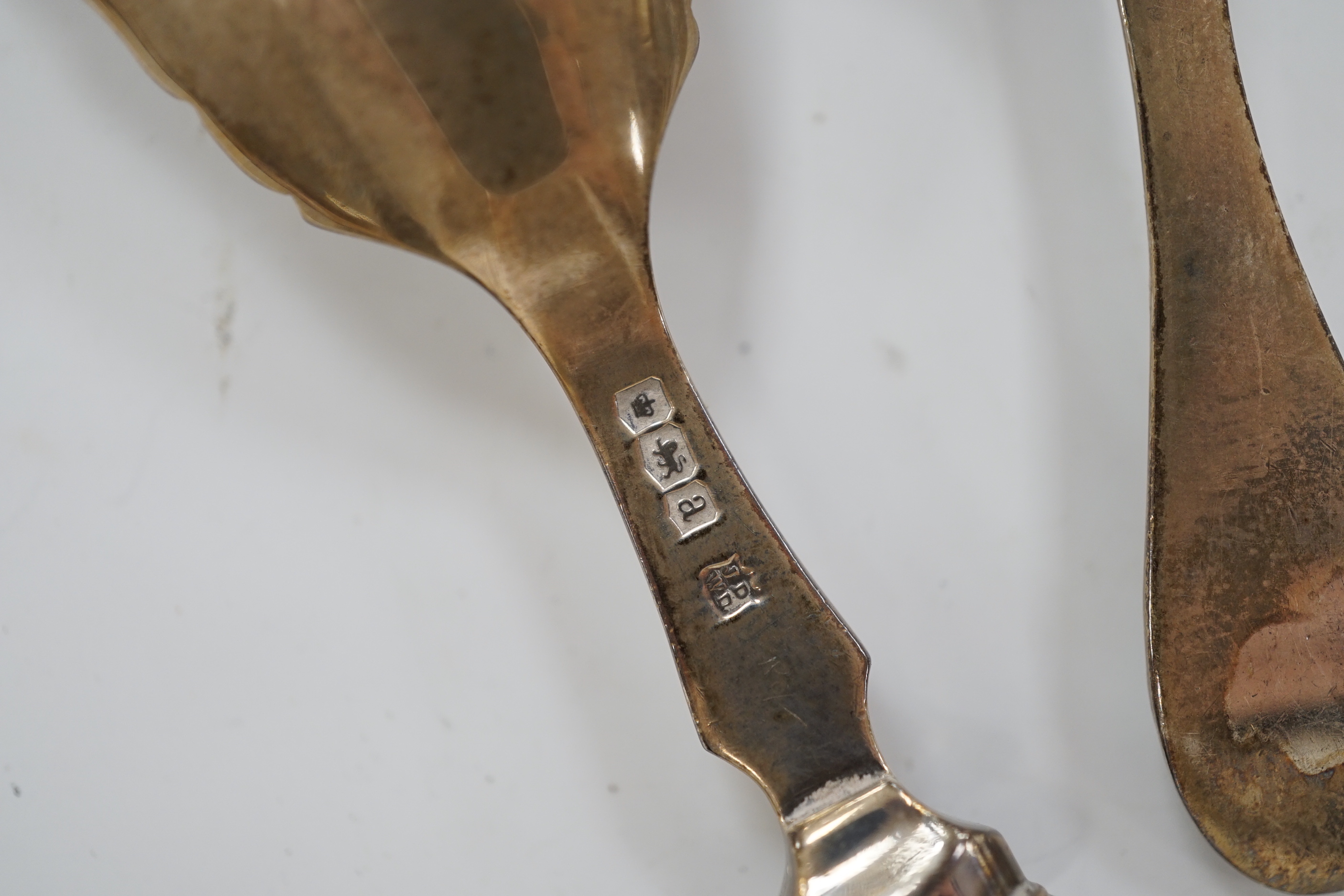 Two 19th century silver caddy spoons including mother of pearl handled by George Unite, 12.1cm and two later silver caddy spoons.